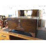 A Chinese hardwood chest with boats carved to top and front, top stamped to interior J.L George &