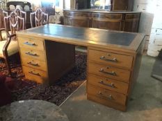 A 1930s/40s cherrywood pedestal desk, with black leather skiver and fitted four drawers to either