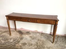 A reproduction mahogany hall table fitted single short frieze drawer, on tapering fluted supports