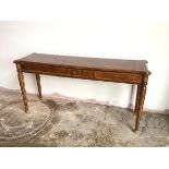 A reproduction mahogany hall table fitted single short frieze drawer, on tapering fluted supports