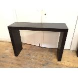 A contemporary console table with dark brown exterior, possibly leather (80cm x 120cm x 36cm)