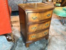 A Burton Reproductions Ltd mahogany small chest of drawers, the moulded top with a bowed front above