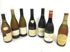 A collection of wines including three white burgundys, two red burgundys, a Cote de Rhone and a