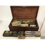 A mahogany hinged box (15cm x 46cm x 23cm), with quantity of vintage tins including Carribean