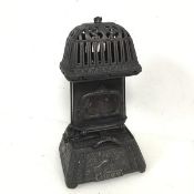 A Victorian cast iron conservatory heater with bird decoration to base and inscribed Early Bird (