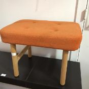 A modern footstool with buttoned upholstered top, on turned oak supports united by side