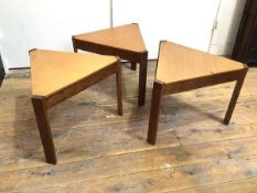 An unusual set of three triangular occasional tables with teak tops on oak frames with straight