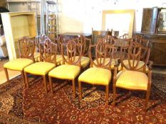 A set of ten reproduction mahogany George III style chairs, the shield backs with Prince of Wales