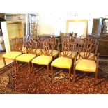 A set of ten reproduction mahogany George III style chairs, the shield backs with Prince of Wales