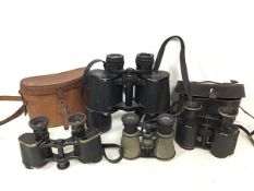 A collection of binoculars including a Tohyoh, a small pair of Edwardian binoculars with metal