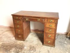 A late 19thc mahogany pedestal desk, with moulded top above dummy central frieze drawer, flanked