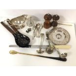 A mixed lot including a white metal candlestick, a bone handled carving knife and stirring spoon,