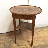 A French Swiss late 19thc walnut occasional table, the oval top with inlay and raised edge above a