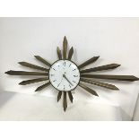 A Metamec metal sunburst clock, battery operated, minute hand slightly bent (48cm x 87cm)