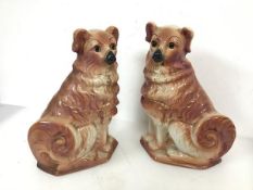 A pair of Victorian Staffordshire chimney spaniels, both marked S to base (32cm)