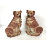 A pair of Victorian Staffordshire chimney spaniels, both marked S to base (32cm)