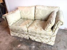 A Wade two seater sofa in a floral damask upholstery with scroll arms and hump back (85cm x 167cm