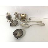 A collection of silver including an 1834 London silver serving spoon, a London 1799 silver fork,