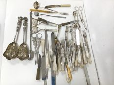 An assortment of Epns including mother of pearl handled fruit knives and forks, grape scissors,