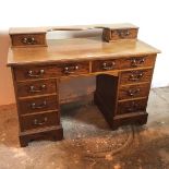 An Edwardian mahogany dressing table, lacking superstructure, fitted two frieze drawers above