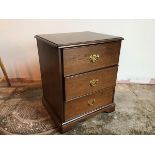 A Stag Georgian style neat chest of drawers fitted three drawers, with drop handles (63cm x 53cm x