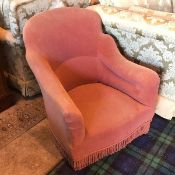 A bedroom tub chair in mauve upholstery, with tassel fringe apron (76cm x 65cm x 66cm)