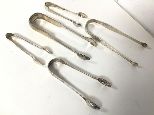 A collection of 19thc and 20thc sugar nips, largest being Edinburgh silver, maker SW (15cm) (