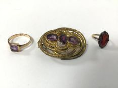 A Victorian gilt metal gem set openwork brooch (4cm), a 9ct gold amethyst ring (2.35g) and a