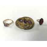 A Victorian gilt metal gem set openwork brooch (4cm), a 9ct gold amethyst ring (2.35g) and a