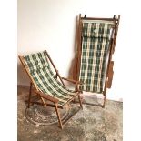 A pair of Australian sou-wester folding deckchairs, with tartan pattern sling seats (unfolded: