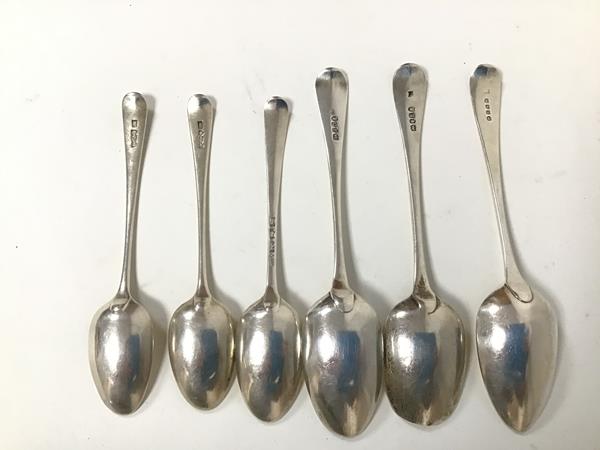 A collection of late 18thc/early 19thc spoons including three serving spoons, three table spoons,