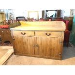 A large early 20thc oak and pine sideboard, the top with three quarter gallery above two frieze