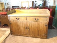 A large early 20thc oak and pine sideboard, the top with three quarter gallery above two frieze