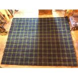 A large machine made mixed fibre carpet with tartan pattern (360cm x 300cm)