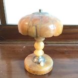 A 1930s/40s alabaster table lamp with scalloped shade above a turned stem, on circular base (24cm