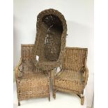 Two 1930s/40s children's wicker chairs including a garden lounger style chair and a baby's basket