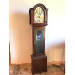 A modern grandfather clock in mahogany case, the domed top above a face inscribed Richard Broad,