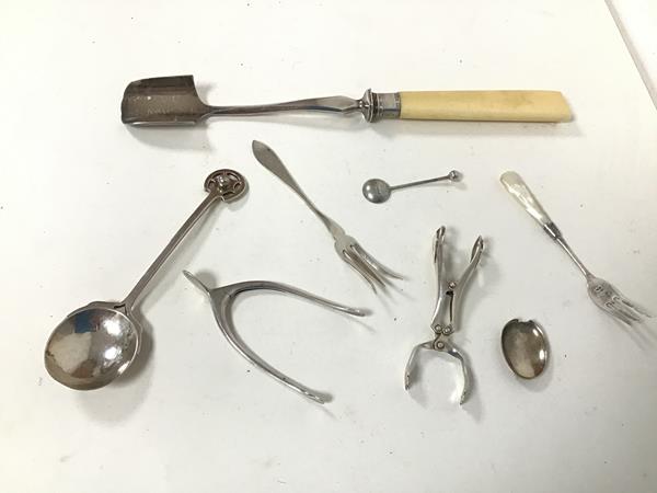 An assortment of silver including a novelty Birmingham silver sugar nips, in the form of a