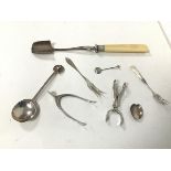 An assortment of silver including a novelty Birmingham silver sugar nips, in the form of a