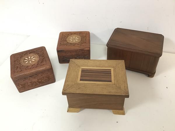A collection of boxes, including two carved Indian boxes with mother of pearl inlay to top, a box