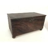 An unusual metal box with outer finish to resemble wood, with hinged lid and unfitted interior, on