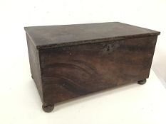 An unusual metal box with outer finish to resemble wood, with hinged lid and unfitted interior, on