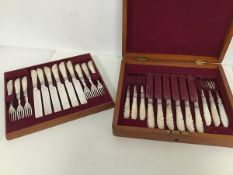 An Edwardian cutlery canteen with a set of twelve fruit knives and forks, with mother of pearl