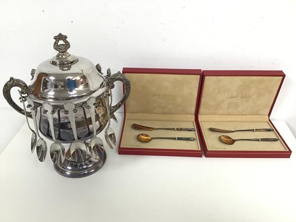 An Epns caviar server, with two C scroll handles to sides and twelve spoon holders, lacking one