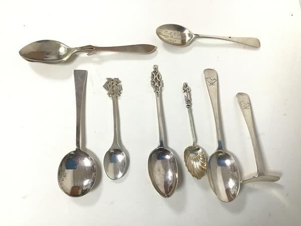 An assortment of silver spoons, including one inscribed William Francis Templeton Anderson, March