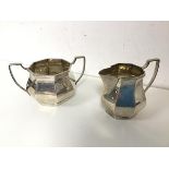 A 1920s Birmingham silver sugar bowl and milk jug (sugar bowl: 7.5cm x 13cm x 9cm) (combined: 258.