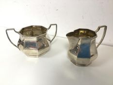 A 1920s Birmingham silver sugar bowl and milk jug (sugar bowl: 7.5cm x 13cm x 9cm) (combined: 258.