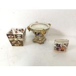 A collection of Imari palette items including an early 19thc Royal Crown Derby pot pourri footed