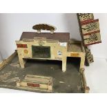 A charming 1940s/50s wooden toy garage, Minic, with lift up roof and possibly unassociated ramp with