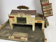 A charming 1940s/50s wooden toy garage, Minic, with lift up roof and possibly unassociated ramp with